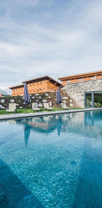 Our hotel with outdoor pool on the Seiser Alm in summer