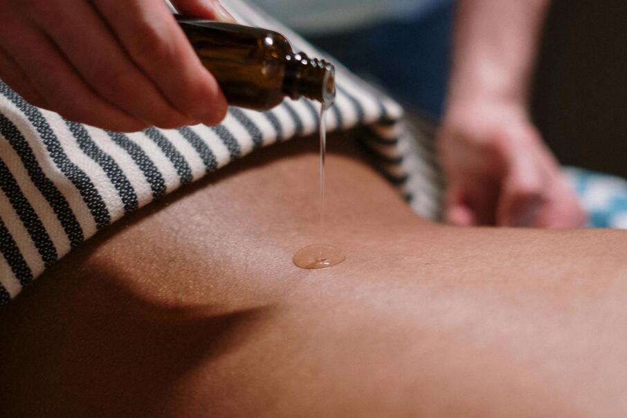 - Massage oil applied during a soothing spa treatment at Hotel Floralpina 15. Massage im Wellnessbereich