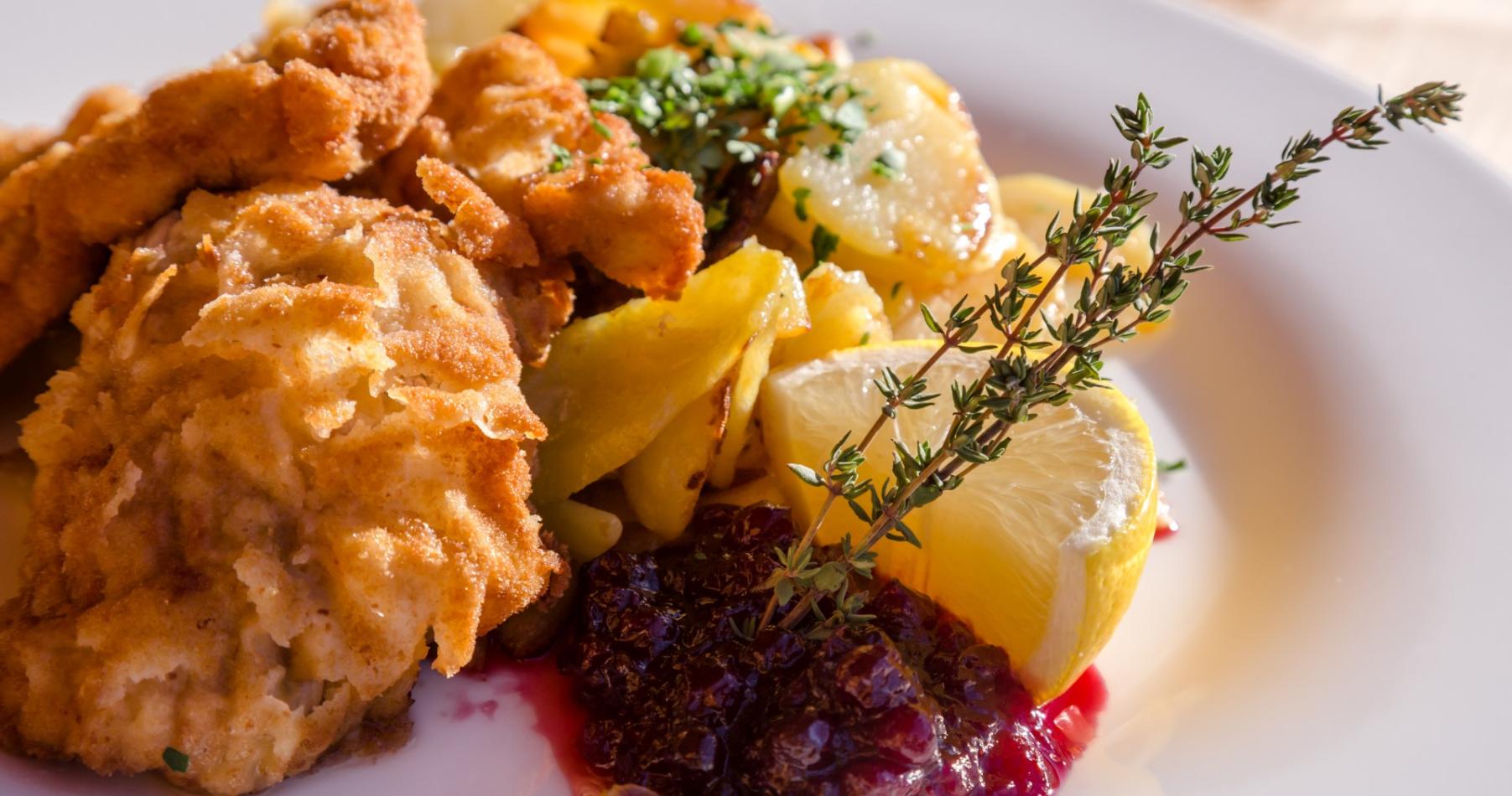 Wiener schnitzel with potatoes and cranberry jam