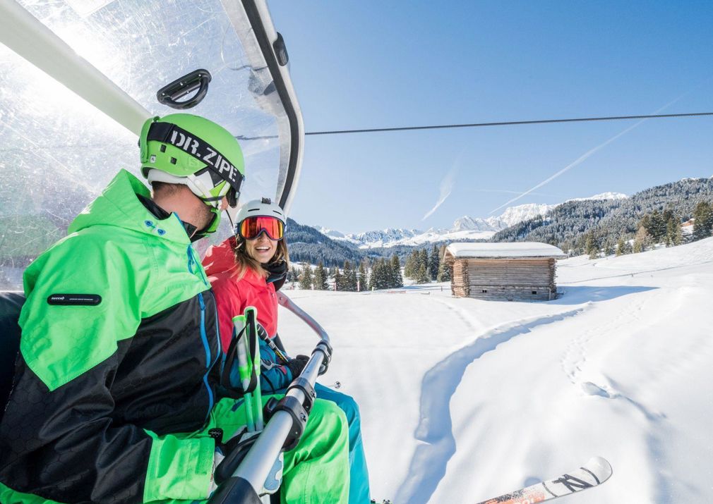Two people on a ski lift