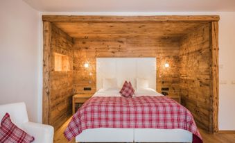 Il letto matrimoniale della camera doppia Alpe 109