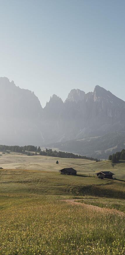 Hiking on Alpe di Siusi Seiser Alm with views of the breathtaking Dolomites