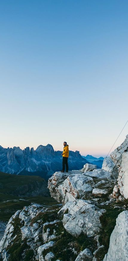 Hiking on the Seiser Alm: a man at the peak of a mountain